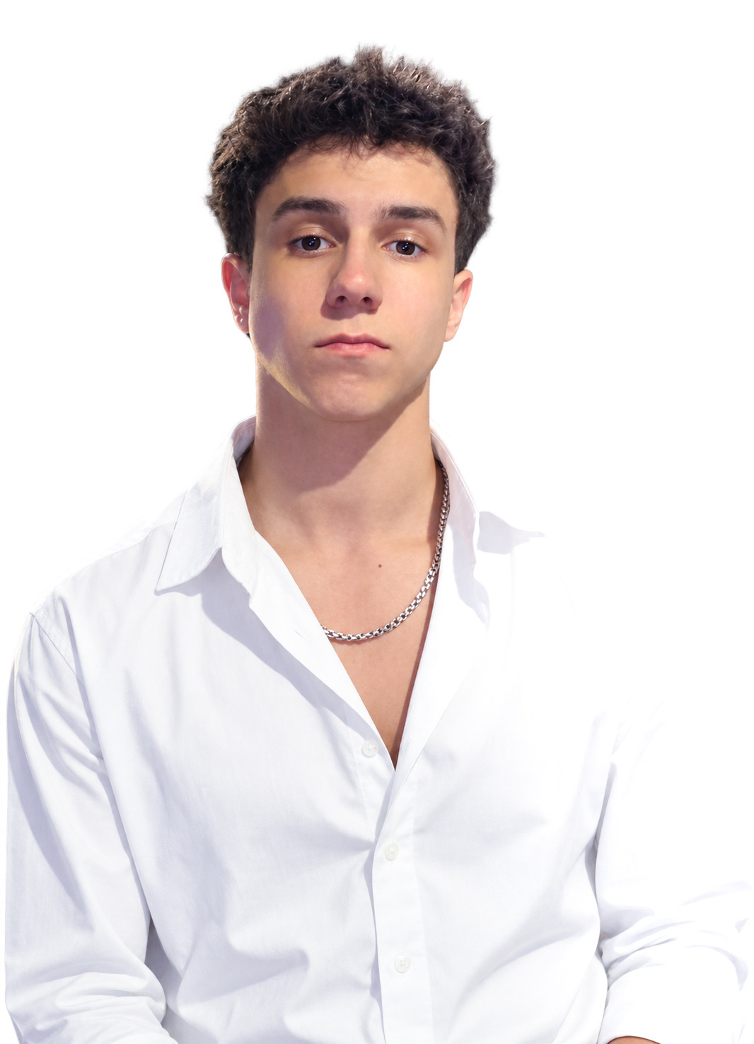 Portrait of Danil, the DS Sight filmmaker, in a white shirt and silver chain
